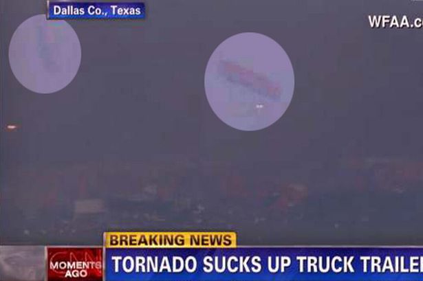 A%20trailer%20from%20a%20truck%20is%20seen%20suspended%20in%20the%20air%20as%20a%20Tornado%20hits%20Dallas,%20Texas