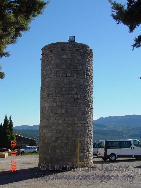 We drove through the tiny village to the little turn off to the tourist parking lot.  The first thing we noticed was this tower in the center of the lot.