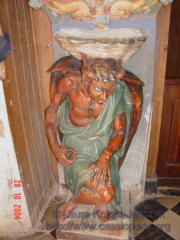 It truly is an interesting piece to place at the door of a church.