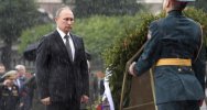 645x344-putin-remains-stoic-despite-pouring-rain-at-war-memorial-1498222612659.jpg