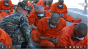 2013 - Gitmo prisoners forced to wear masks....PNG