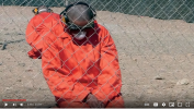 2013 - Gitmo prisoners forced to wear masks..3.PNG