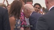Biden nibbles on frightened young girl.jpg