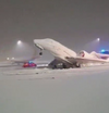 Munich airport plane snow 2023.png