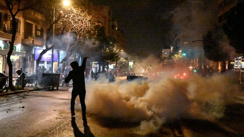 Protesters clash with police outside the Hellenic Train headquarters in Athens on 1 March