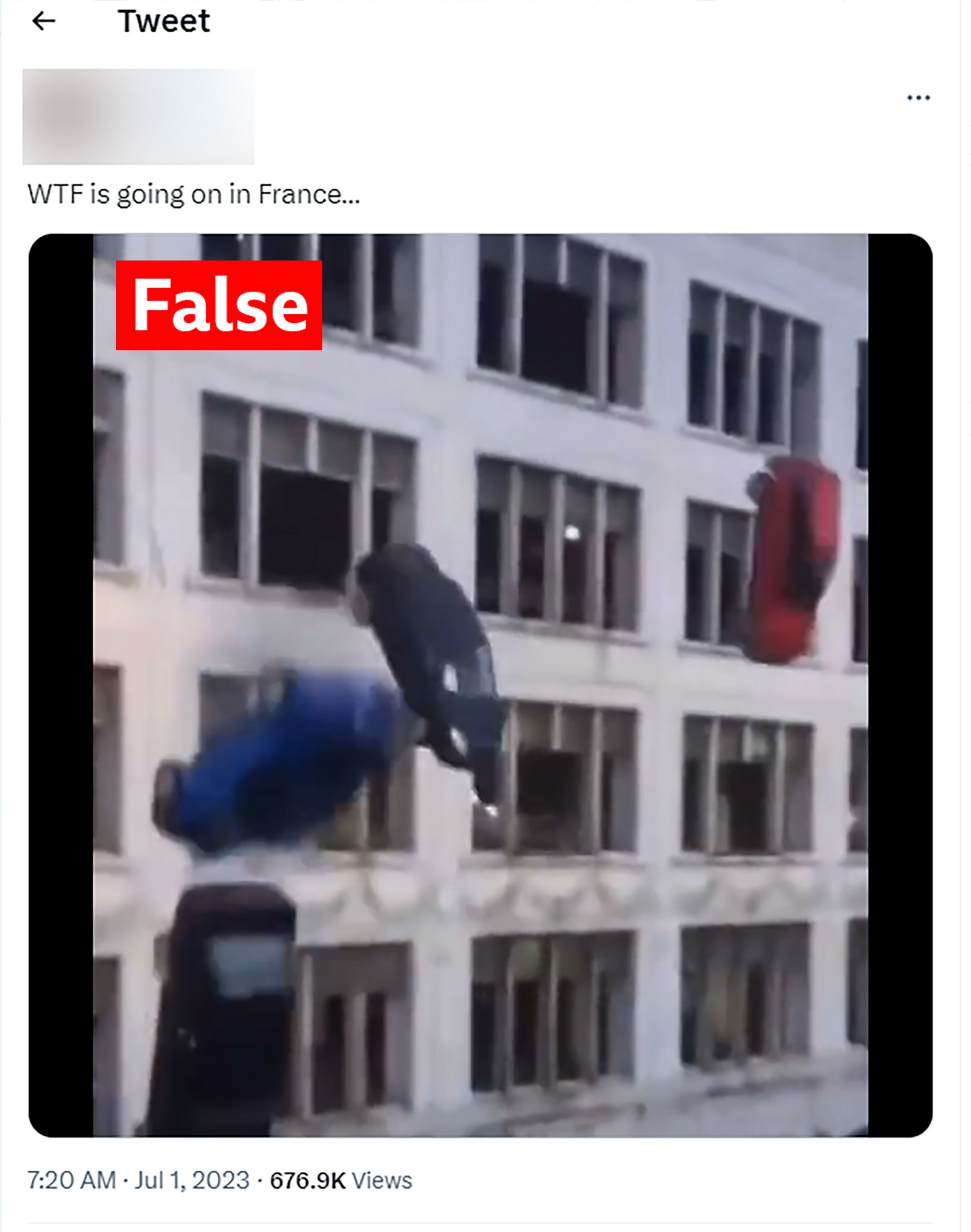 An image of cars falling from a multi-storey car park, taken from a tweet and labelled false