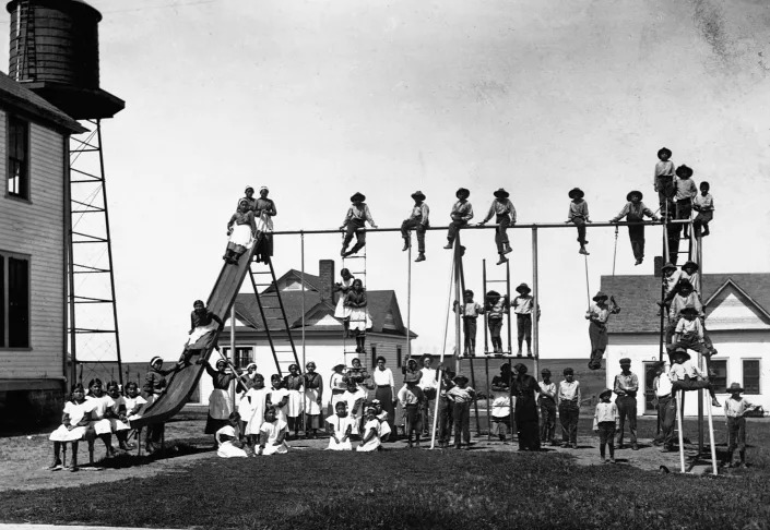 Children play at an Indian boarding school in Kickapoo, Kansas in an undated photo. (Corbis via Getty Images)