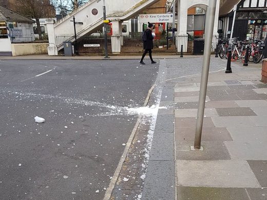 Onlookers took photos of the smashed ice block