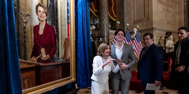 Speaker of the House Nancy Pelosi, D-Calif., is joined by her family as they attend her portrait unveiling ceremony in Statuary Hall at the Capitol in Washington, Wednesday, Dec. 14, 2022. 