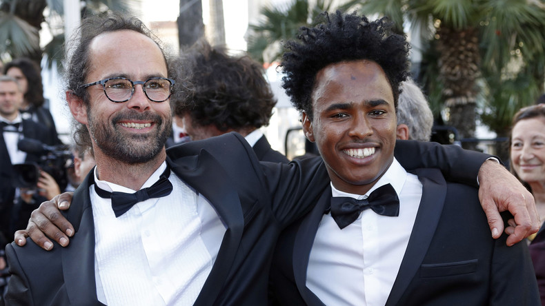 The glamorous life of an open-borders lawbreaker: Cédric Herrou and a trophy migrant on the red carpet at the Cannes Film Festival. (You may enjoy other tragicomic pictures by searching for “Cédric Herrou” on Google Images.)