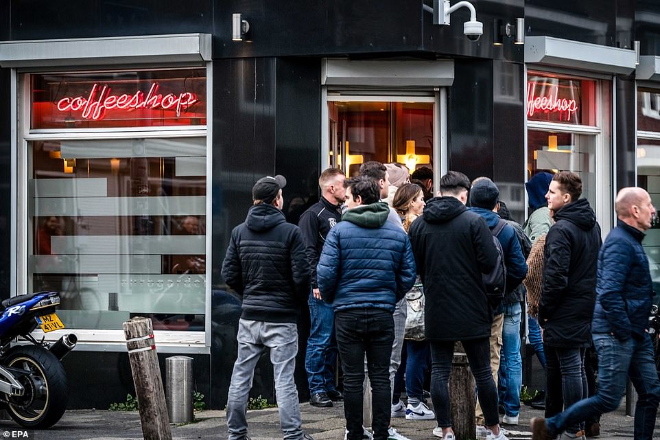 26025862-8116793-A_queue_of_people_outside_a_coffee_shop_in_Eindhoven_yesterday_C-a-43_1584363936301.jpg