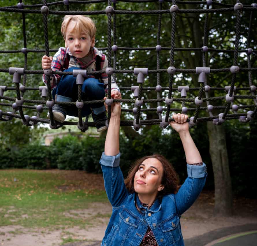 Stella Moris, partner of Julian Assange, with one of their sons in a children's palyground. Autumn 2021