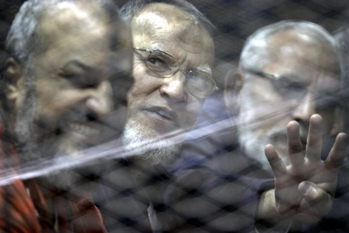Mohammad Badi (L), head of the Muslim Brotherhood Guidance Council, Muhammed el-Biltaci (R), one of the Muslim Brotherhood Leaders, and Muslim Brotherhood member Essam Al-Aryan (C) are seen inside the defendants' cage during the trial known as ''Bahr Al-Azam'' case, in Cairo, Egypt on 24 November 2016. [Moustafa Elshemy - Anadolu Agency]