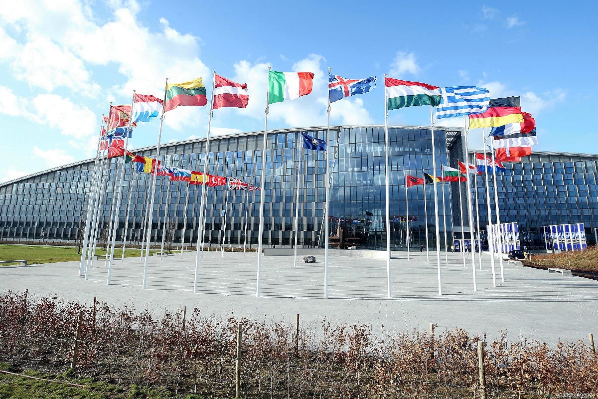 Flags of members of North Atlantic Treaty Organisation (NATO) wave outside of the NATO Headquarters in Brussels, Belgium on 14 March 2019 [Dursun Aydemir/Anadolu Agenc