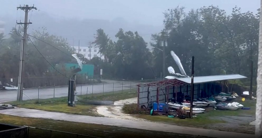 PHOTO: Winds tear roofing off a shed as Typhoon Mawar bears down on Guam, May 24, 2023. PHOTO: Winds tear roofing off a shed as Typhoon Mawar bears down on Guam, May 24, 2023.