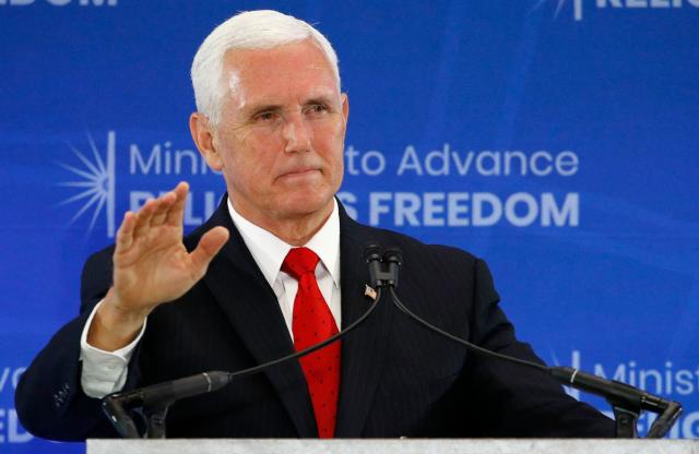 Nothing to worry about. Mike Pence was just staying far away from an alleged drug dealer. (Photo: ASSOCIATED PRESS)