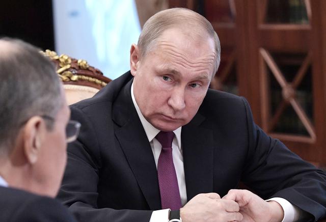Russian President Vladimir Putin looks on during a meeting with Defence Minister Sergei Shoigu and Foreign Minister Sergei Lavrov at the Kremlin in Moscow, Russia, February 2, 2019. Sputnik/Alexei Nikolsky/Kremlin via REUTERS