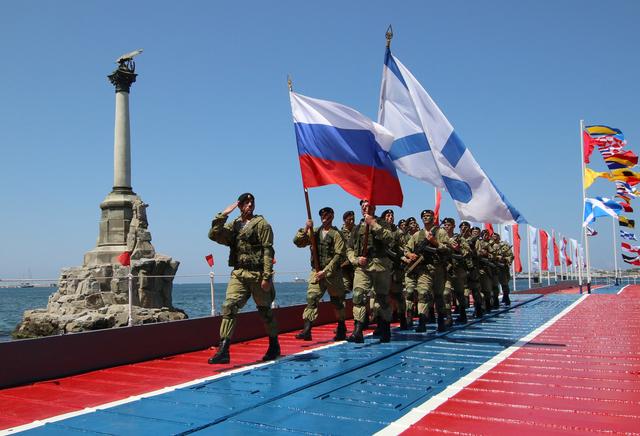 FILE PHOTO: Russian marines march during the Navy Day parade in the Black Sea port of Sevastopol, Crimea, July 29, 2018. REUTERS/Pavel Rebrov