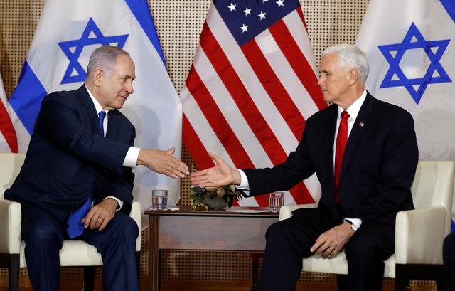 U.S. Vice President Mike Pence and Israeli Prime Minister Benjamin Netanyahu shake hands as they meet in Warsaw, Poland, February 14, 2019. REUTERS/Kacper Pempel