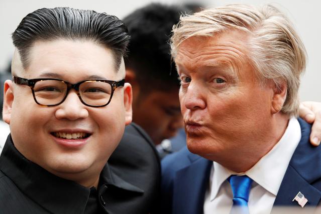 Howard X, an Australian-Chinese impersonator of North Korean leader Kim Jong Un and Russell White, who is impersonating U.S. President Donald Trump, pose for a photo outside the Opera House, ahead of the upcoming Trump-Kim summit in Hanoi, Vietnam, February 22, 2019. REUTERS/Jorge Silva