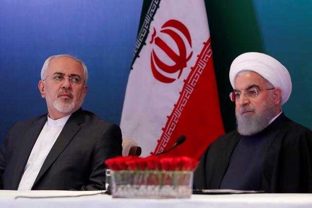 FILE PHOTO - Iranian President Hassan Rouhani (R) and Foreign Minister Mohammad Javad Zarif attend a meeting with Muslim leaders and scholars in Hyderabad, India, February 15, 2018. REUTERS/Danish Siddiqui