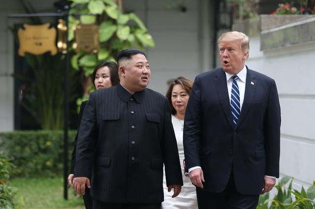 North Korea's leader Kim Jong Un and U.S. President Donald Trump talk in the garden of the Metropole hotel during the second North Korea-U.S. summit in Hanoi, Vietnam February 28, 2019. REUTERS/Leah Millis