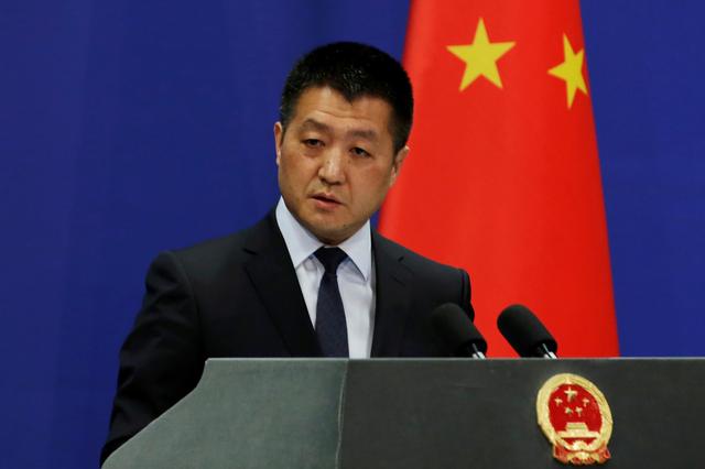 FILE PHOTO:  Chinese Foreign Ministry spokesman Lu Kang answers questions about a major bus accident in North Korea, during a news conference in Beijing, China April 23, 2018.  REUTERS/Jason Lee