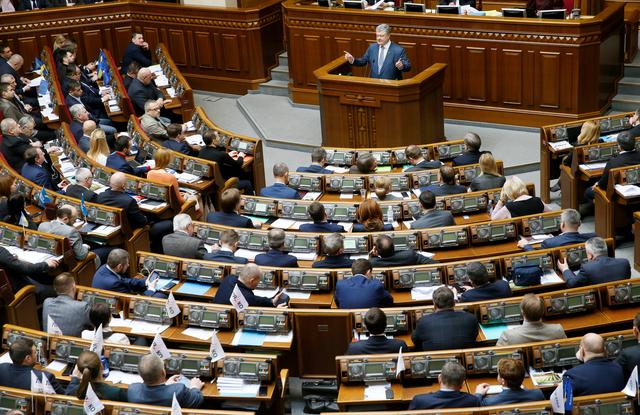 FILE PHOTO: Ukrainian President Petro Poroshenko addresses lawmakers during a session of parliament in Kiev, Ukraine February 7, 2019. REUTERS/Valentyn Ogirenko/File Photo