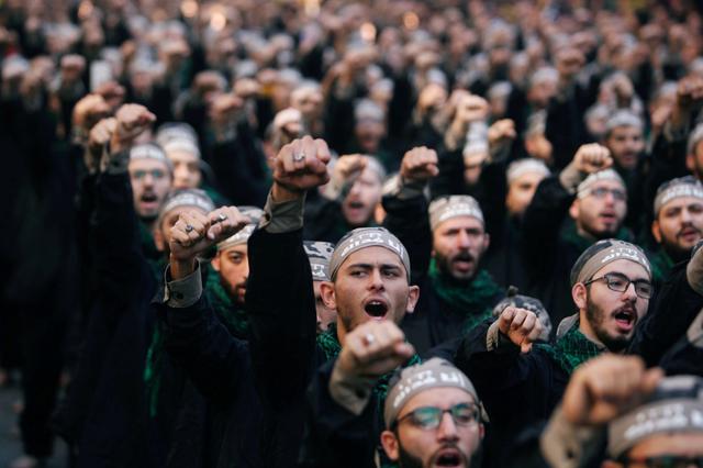 FILE PHOTO: Lebanon's Hezbollah supporters chant slogans during last day of Ashura, in Beirut, Lebanon September 20, 2018. REUTERS/Aziz Taher/File Photo