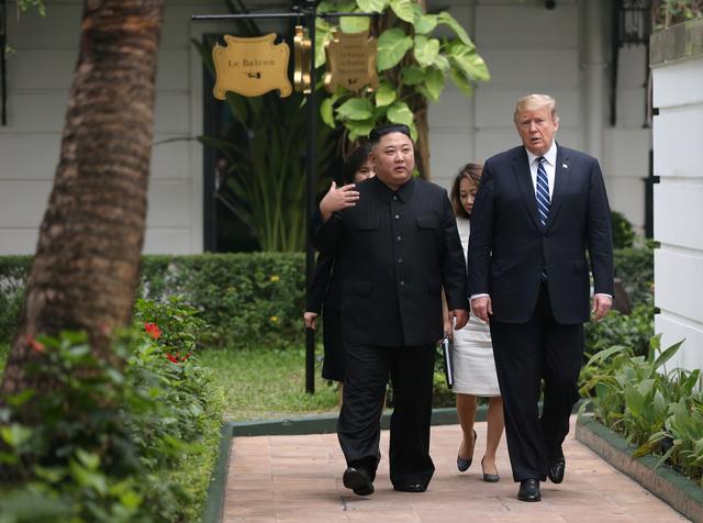 North Korea's leader Kim Jong Un and U.S. President Donald Trump talk in the garden of the Metropole hotel during the second North Korea-U.S. summit in Hanoi, Vietnam February 28, 2019. REUTERS/Leah Millis     