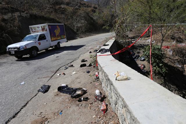 A view shows clothing and items scattered on the site where a cargo truck careened off a road and turned over, killing at least 25 migrants from Central America, in Francisco Sarabia, Chiapas state, Mexico March 8, 2019. REUTERS/Jacob Garcia 