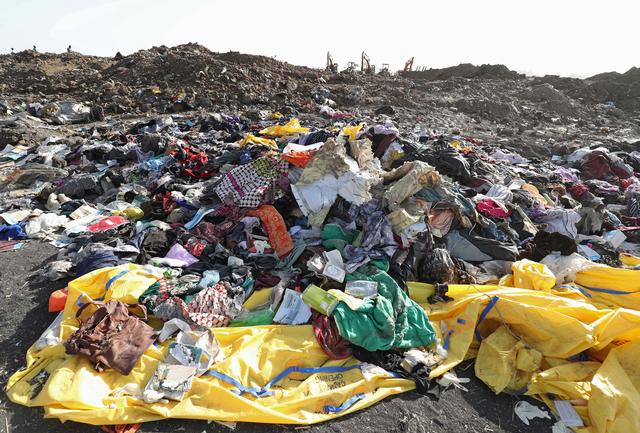 Clothing and personal effects from passengers are seen near the wreckage at the scene of the Ethiopian Airlines Flight ET 302 plane crash, near the town of Bishoftu, southeast of Addis Ababa, Ethiopia March 11, 2019. REUTERS/Tiksa Negeri