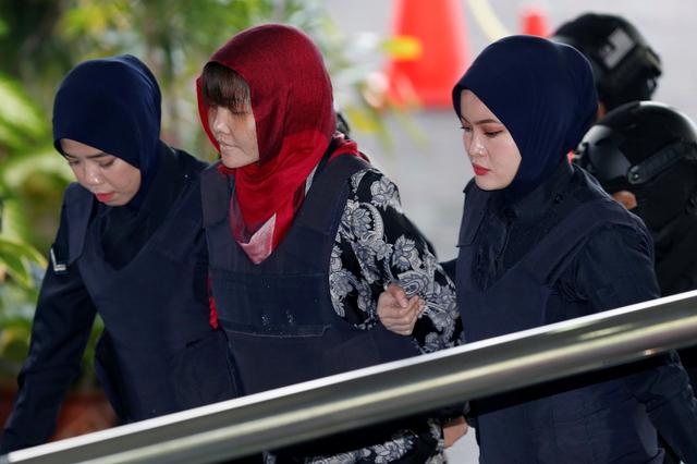 Vietnamese Doan Thi Huong, who was a suspect in the murder case of North Korean leader's half brother Kim Jong Nam, is escorted as she arrives at the Shah Alam High Court on the outskirts of Kuala Lumpur, Malaysia March 14, 2019. REUTERS/Lai Seng Sin