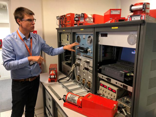 An official from FranceÕs BEA air crash investigation agency speaks near the machines used to listen to tapes that are recovered from black boxes during a press visit at their offices in Le Bourget, France, September 14, 2018. Picture taken September 14, 2018.   REUTERS/Tim Hepher