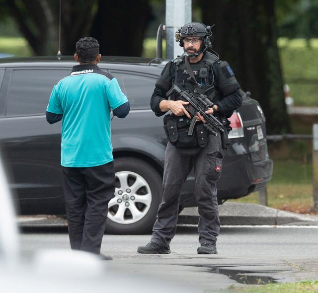 AOS (Armed Offenders Squad) push back members of the public following a shooting at the Al Noor mosque in Christchurch, New Zealand, March 15, 2019. REUTERS/SNPA/Martin Hunter