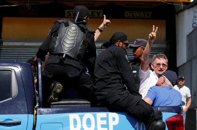 A demonstrator gestures as he is detained by riot police during a protest against the government of Nicaragua's President Daniel Ortega in Managua, Nicaragua March 16, 2019. REUTERS/Oswaldo Rivas