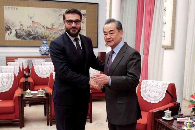 FILE PHOTO: Afghanistan National Security Advisor Hamdullah Mohib shakes hands with Chinese Foreign Minister Wang Yi before their meeting at the Zhongnanhai Leadership Compound in Beijing, China January 10, 2019. Andy Wong/Pool via REUTERS/File Photo