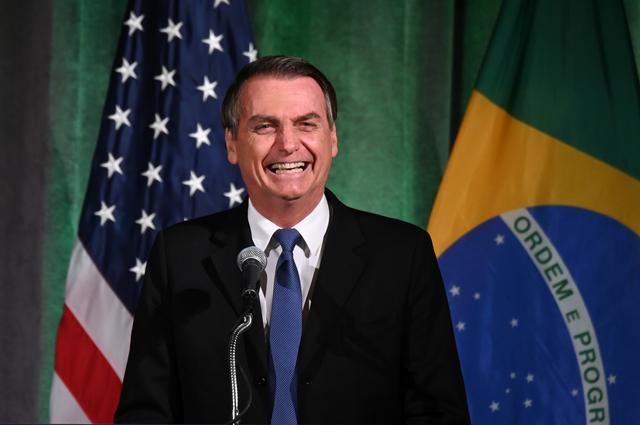 FILE PHOTO: Brazilian President Jair Bolsonaro participates in a Brazil-U.S. Business Council forum to discuss relations and future cooperation and engagement in Washington, U.S. March 18, 2019. REUTERS/Erin Scott