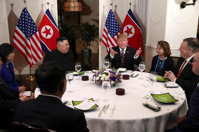 FILE PHOTO - U.S. President Donald Trump and North Korean leader Kim Jong Un sit down for a dinner during the second U.S.-North Korea summit at the Metropole Hotel in Hanoi, Vietnam February 27, 2019. REUTERS/Leah Millis/File Photo