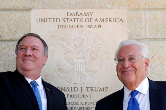 U.S. Secretary of State Mike Pompeo and U.S. Ambassador to Israel David Friedman stand next to the dedication plaque at the U.S. embassy in Jerusalem March 21, 2019. REUTERS/Jim Young/Pool