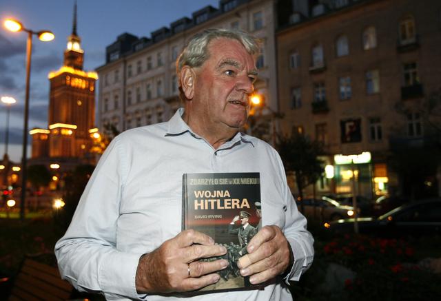 FILE PHOTO: David Irving, the British Holocaust-denier, holds his book titled It happened in the XX century Hitler's War as he speaks to Reuters during an interview in Warsaw September 21, 2010. REUTERS/Kacper Pempel 