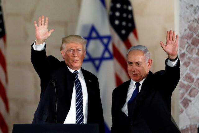FILE PHOTO: U.S. President Donald Trump and Israeli Prime Minister Benjamin Netanyahu wave after Trump's address at the Israel Museum in Jerusalem May 23, 2017. REUTERS/Ronen Zvulun/File Photo