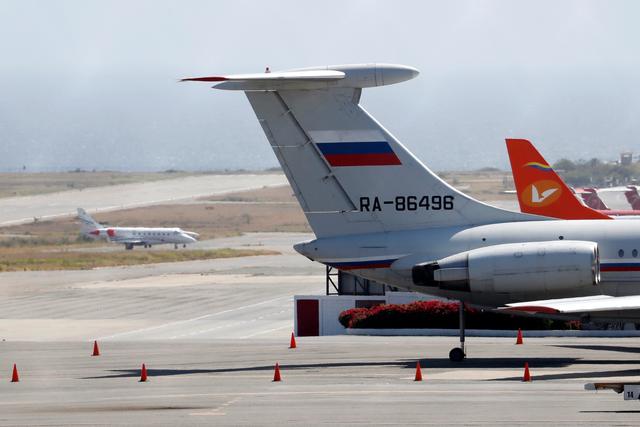 FILE PHOTO: An airplane with the Russian flag is seen at Simon Bolivar International Airport in Caracas, Venezuela March 24, 2019. REUTERS/Carlos Jasso/File Photo