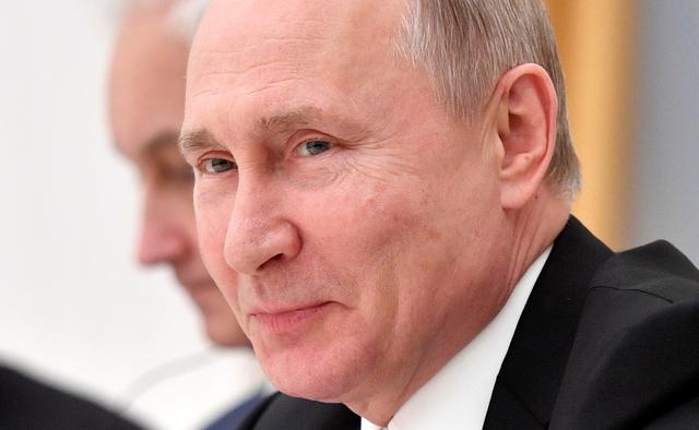 FILE PHOTO: Russian President Vladimir Putin reacts during a meeting with businessmen and officials in Moscow, Russia March 20, 2019. Alexander Nemenov/Pool via REUTERS