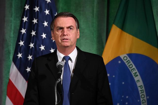 FILE PHOTO - Brazilian President Jair Bolsonaro participates in a Brazil-U.S. Business Council forum to discuss relations and future cooperation in Washington, U.S. March 18, 2019. REUTERS/Erin Scott
