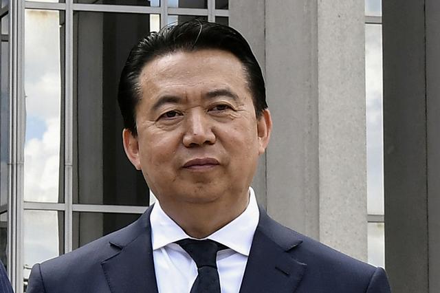 FILE PHOTO: INTERPOL President Meng Hongwei poses during a visit to the headquarters of International Police Organisation in Lyon, France, May 8, 2018. Jeff Pachoud/Pool via Reuters/File Photo