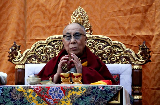 FILE PHOTO: Tibet's exiled spiritual leader the Dalai Lama delivers teachings during the first day of New Year or Losar in the northern hill town of Dharamsala, India February 22, 2012. REUTERS/Stringer/File Photo