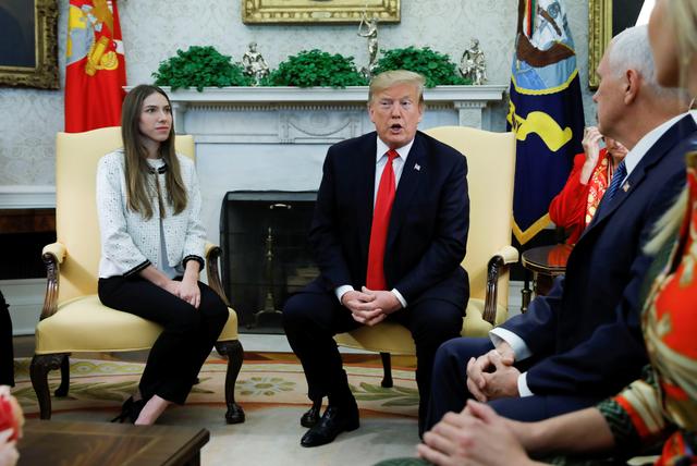 U.S. President Donald Trump and Vice President Mike Pence meet with Fabiana Rosales, wife of Venezuelan opposition leader Juan Guaido, in the Oval Office at the White House in Washington, U.S., March 27, 2019. REUTERS/Carlos Barria