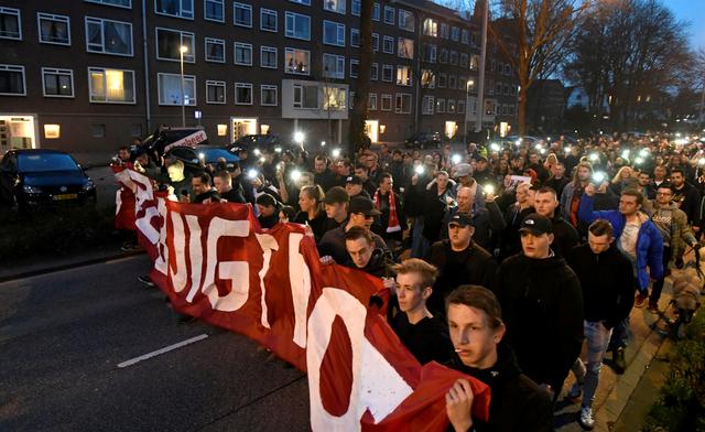 FILE PHOTO: People attend a silent march in Utrecht in honour of the people wounded or killed in an attack on a tram on Monday, in Utrecht, Netherlands March 22, 2019. REUTERS/Piroschka Van De Wouw/File Photo