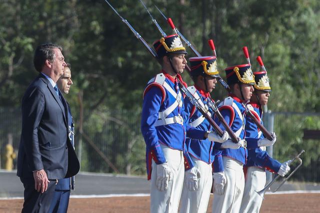 FILE PHOTO: Brazil's President Jair Bolsonaro attends a flag hoisting ceremony at Alvorada Palace in Brasilia, Brazil March 29, 2019. Antonio Cruz/Agencia Brasil/Handout via REUTERS 